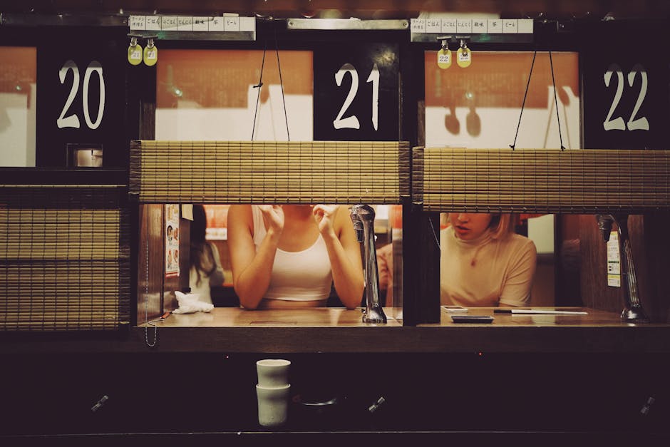 Intimate dining experience at a ramen restaurant in Shibuya, Tokyo with individual booths